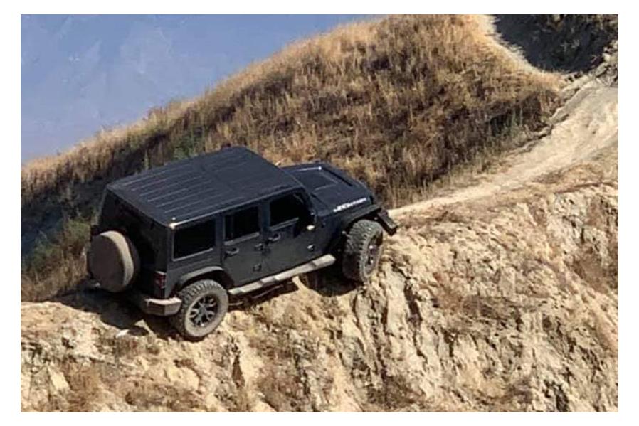 This Jeep Wrangler Got Stuck At The Top Of A Ridge (But Has Now Been Rescued)