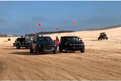 Drag Race: New Ford Bronco Vs. F-150 Raptor In The Sand